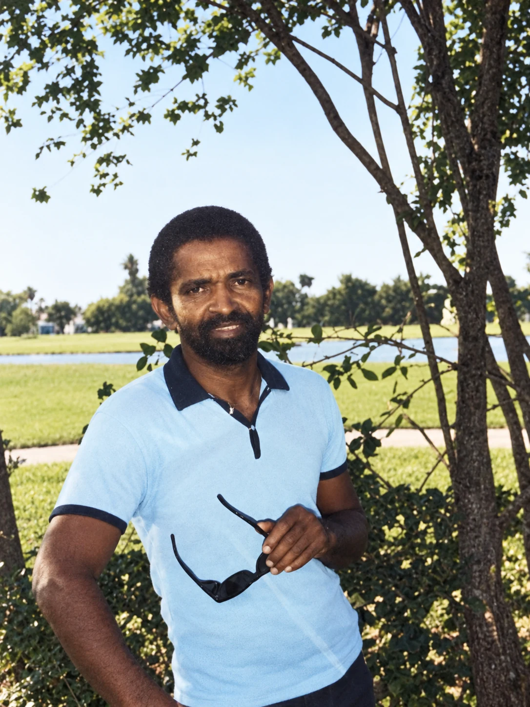 A restored family portrait of Carl Barclay outdoors.