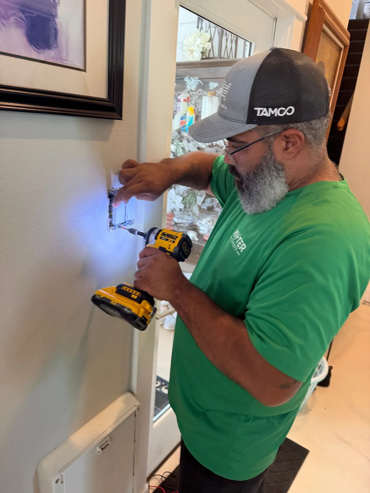 Mister Safety technician fitting a wall control during installation