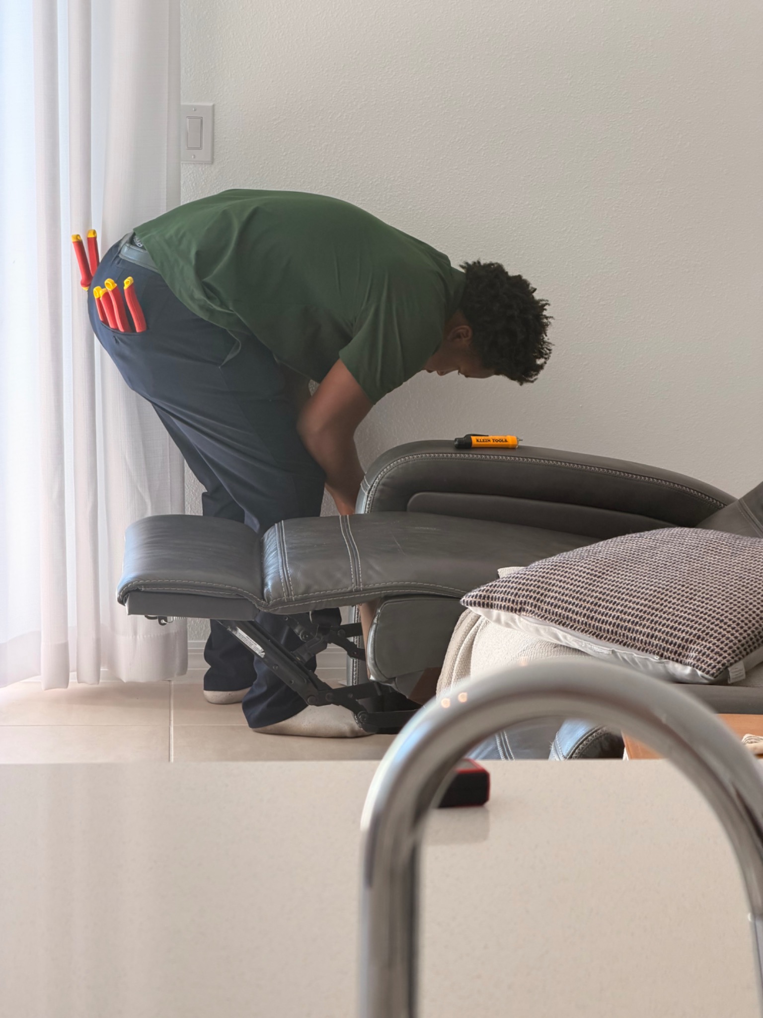 Patrick in the Mister Safety uniform during an in-home electrical service visit